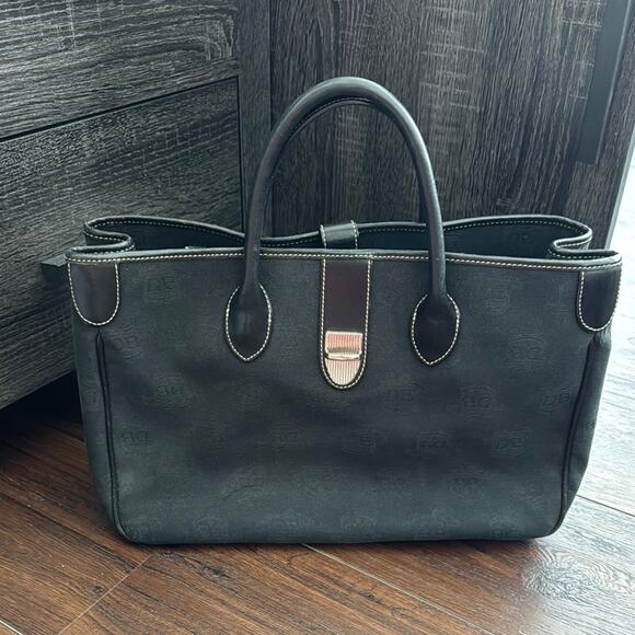 Dooney & Bourke Pre owned Black Leather Trim Tote with Silver Hardware.
